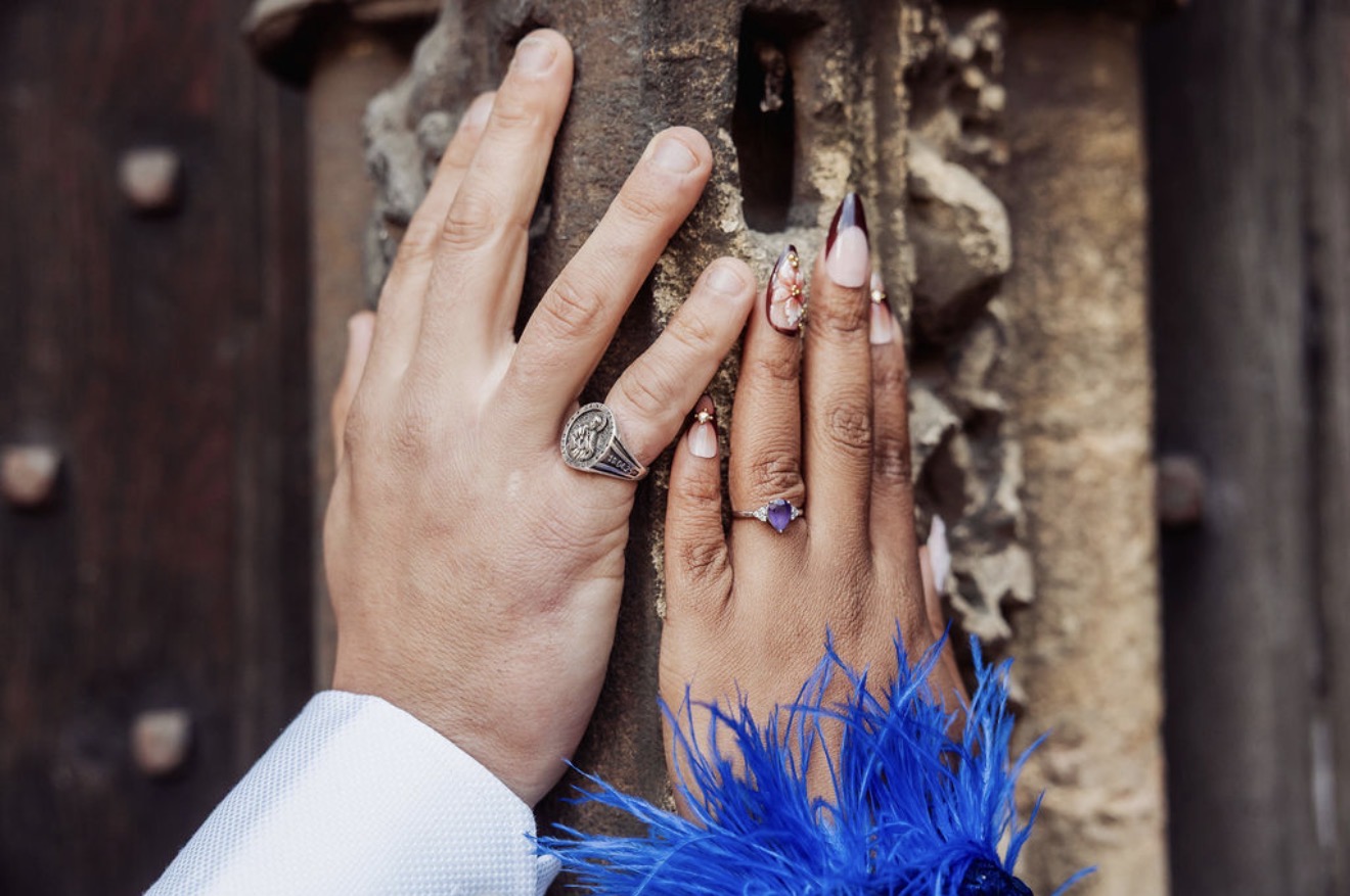 A close-up of the couple’s rings, including Gabriella’s purple stone. Photograph: Thomasxphotography