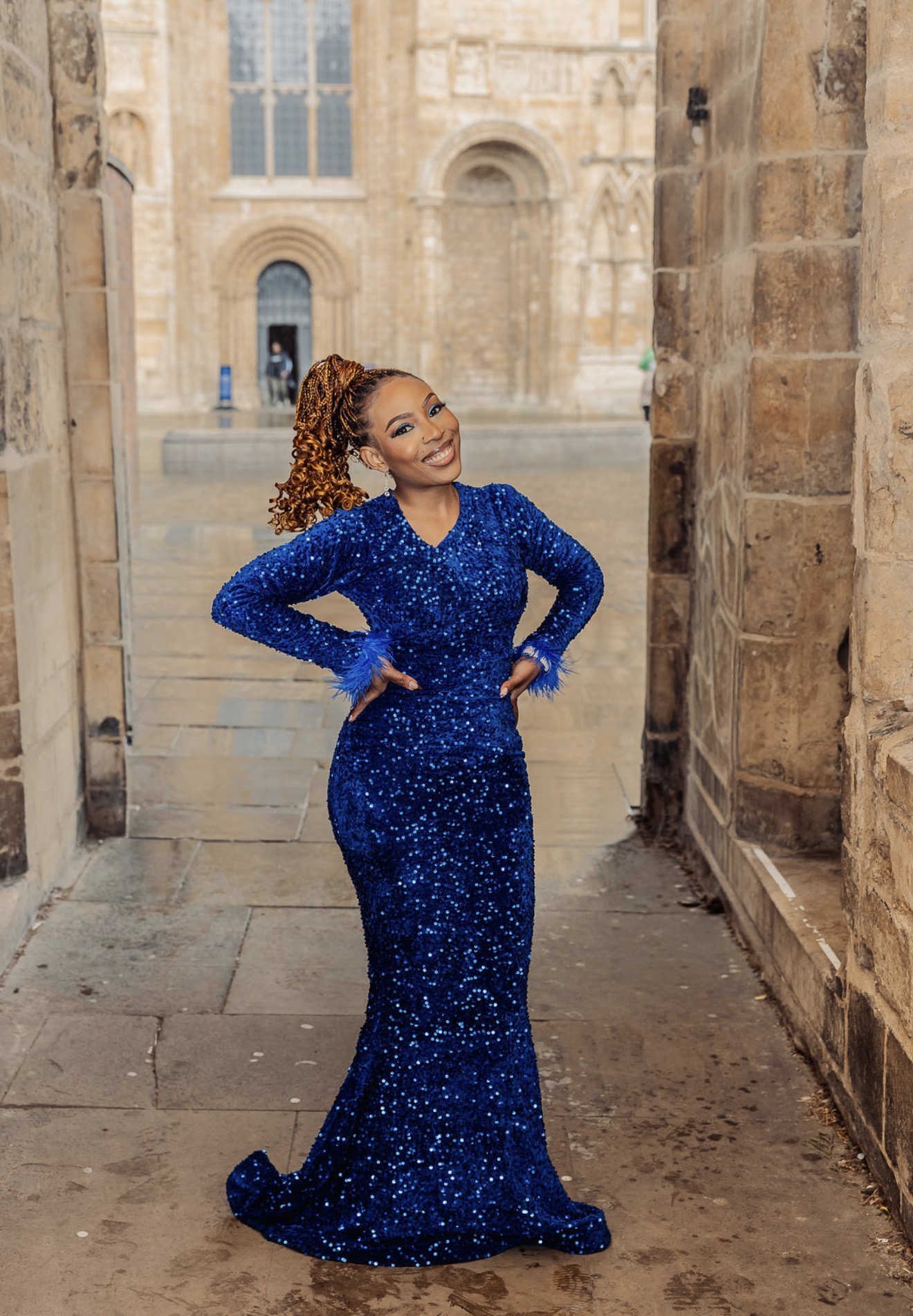 Gabriella Ndukwe in a royal blue sequined gown with feathered cuffs. Photograph: Thomasxphotography
