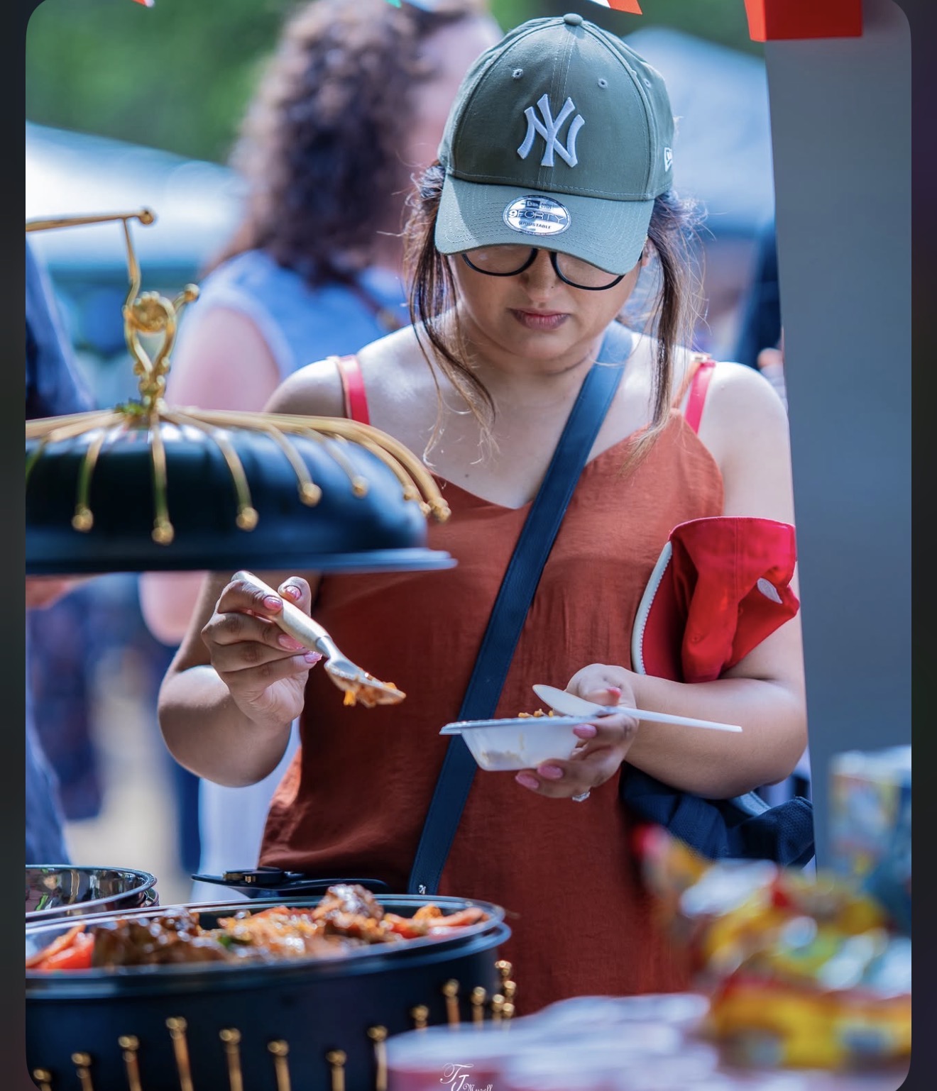 A visitor samples one of the dishes served at the festival. Photograph: Joakraft Photography