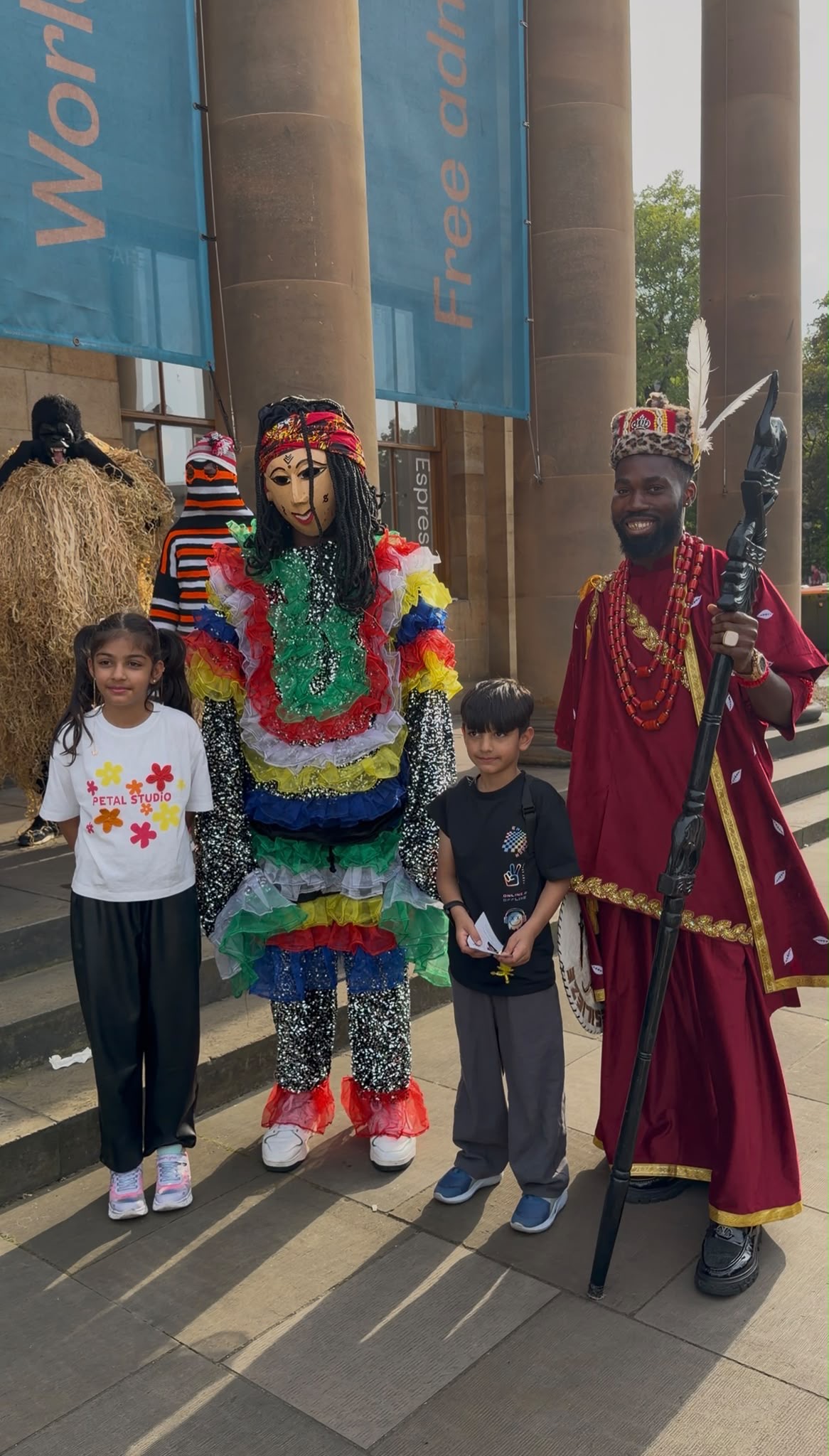 Chigozie Nwaodo poses with two children and a costumed performer at the Edinburgh Fringe Festival. Photograph: Supplied