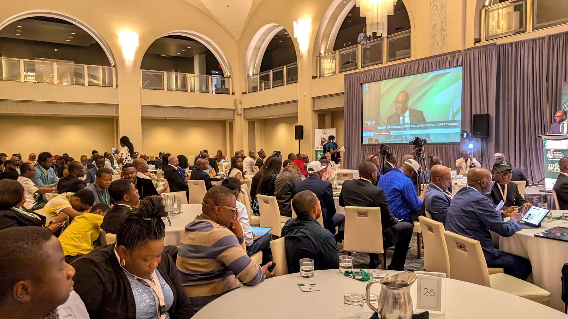 Delegates follow proceedings on the main screen at the Apollo Convention Centre, Toronto.